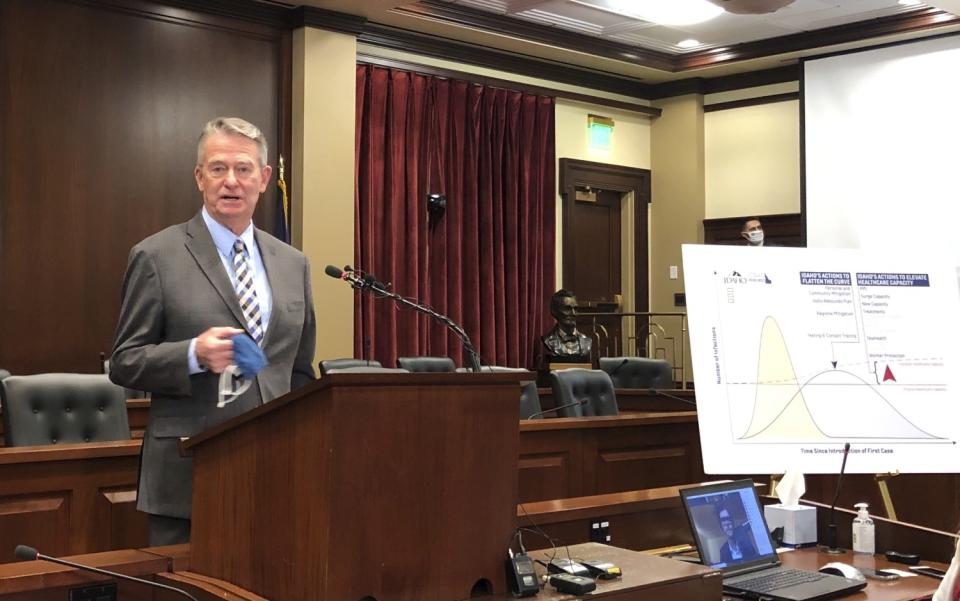 Republican Gov. Brad Little speaks to reporters in the Statehouse in Boise, Idaho.