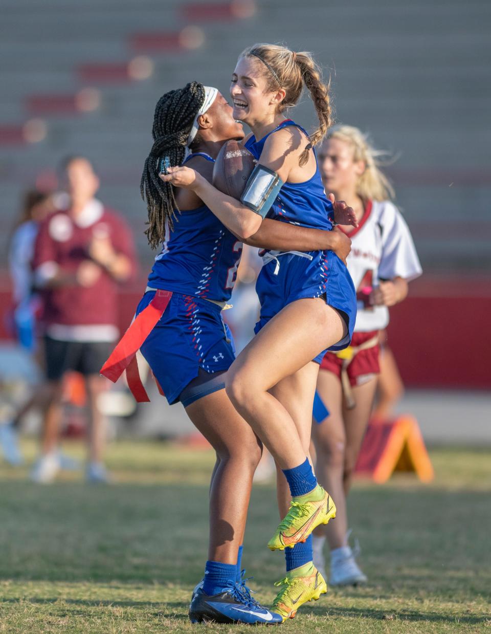 Berkleigh Jernigan (9) celebrates with Ashten Dickerson (20) after making a touchdown to tie the score at 6-6 during the Chiles vs Pace girls flag football game at Pace High School on Thursday, May 5, 2022.