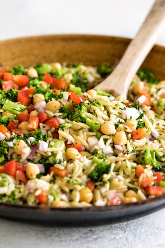 <p>Girl Gone Gourmet</p><p>This orzo pasta salad with broccoli, bell pepper, red onion, and chickpeas is a great summer side dish. It’s tossed in a lemony mustard vinaigrette making it a fresh and light summer side dish for grilled steak, chicken, or seafood. Make it ahead to let all the flavors marry together and serve it cold or at room temperature.</p><p><strong>Get the recipe: <a href="https://www.girlgonegourmet.com/orzo-pasta-salad/" rel="nofollow noopener" target="_blank" data-ylk="slk:Orzo Pasta Salad;elm:context_link;itc:0;sec:content-canvas" class="link ">Orzo Pasta Salad</a></strong></p>