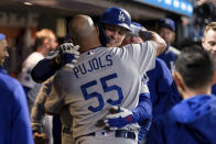 Los Angeles Dodgers' Corey Seager, back, celebrates with Albert Pujols (55) after hitting a solo home run against the San Francisco Giants during the ninth inning of a baseball game in San Francisco, Saturday, Sept. 4, 2021. (AP Photo/John Hefti)