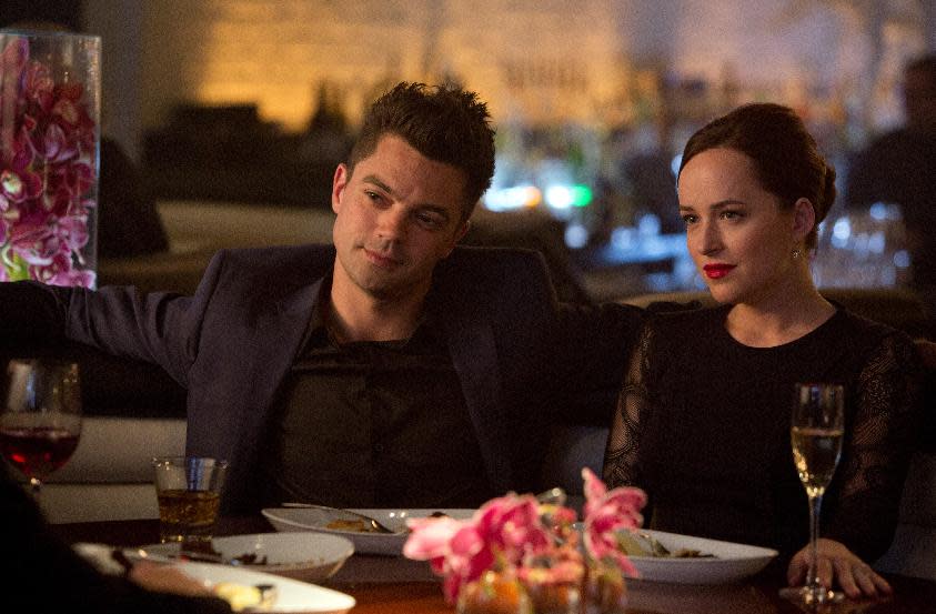 This image released by DreamWorks II shows Dominic Cooper, left, and Dakota Johnson in a scene from “Need for Speed.” (AP Photo/DreamWorks II, Melinda Sue Gordon)