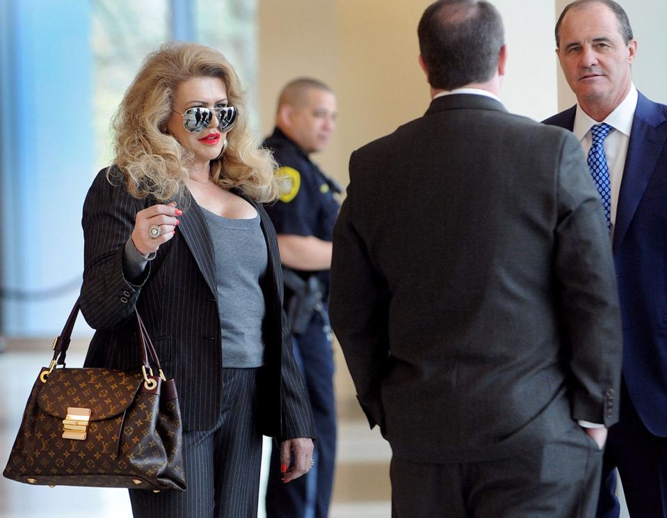 Claire Risoldi confers with her attorneys outside the courtroom at the Bucks County Justice Center in Doylestown on Friday, April 29, 2016