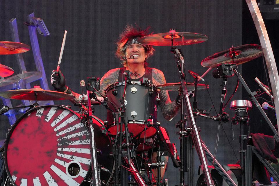 Tommy Lee of Motley Crue is only playing a few songs during the set because of several broken ribs.