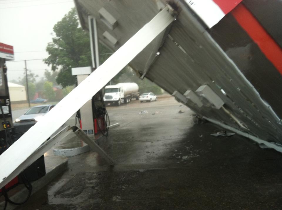 This photo provided by Mark Sarlo shows damage to a gas station after severe weather passed through the area on Monday, June 17, 2013 in La Junta, Colo. National Weather Service spokeswoman Nezette Rydell said the tornado knocked down power poles in an industrial park near La Junta on Monday, but no injuries have been reported. More storms are expected on Tuesday. La Junta Fire Chief Aaron Eveatt said high winds raked the city, knocking down power poles in town and forcing the closure of a U.S. Highway 50, a main highway. (AP Photo/Mark Sarlo)