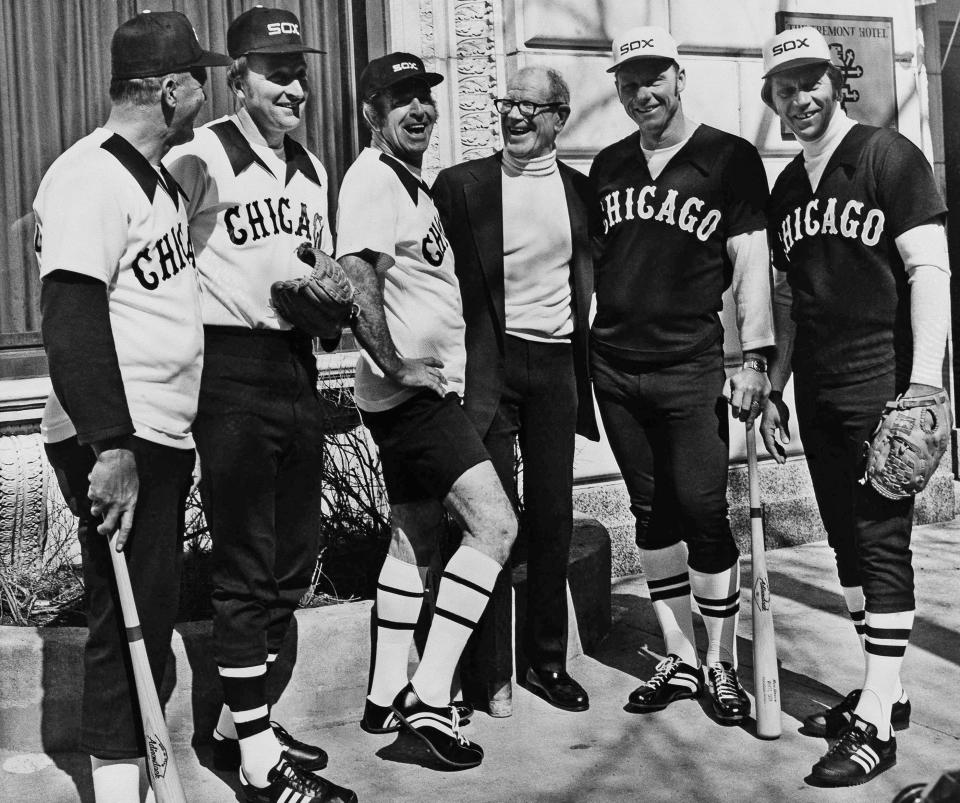 FILE - Five retired Major League baseball players appear in Chicago, in this Tuesday, March 10, 1976, file photo, with Chicago White Sox owner Bill Veeck as they showed new uniforms that the White Sox will be wearing. Three home game uniforms at left are worn by, from left, Bill "Moose" Skowron, Mo Drabowski and Jim K. Rivera, wearing a home hot weather uniforms At right are the road uniforms worn by Dave Nicholson and Dan Osinski. (AP Photo/Lo, File)