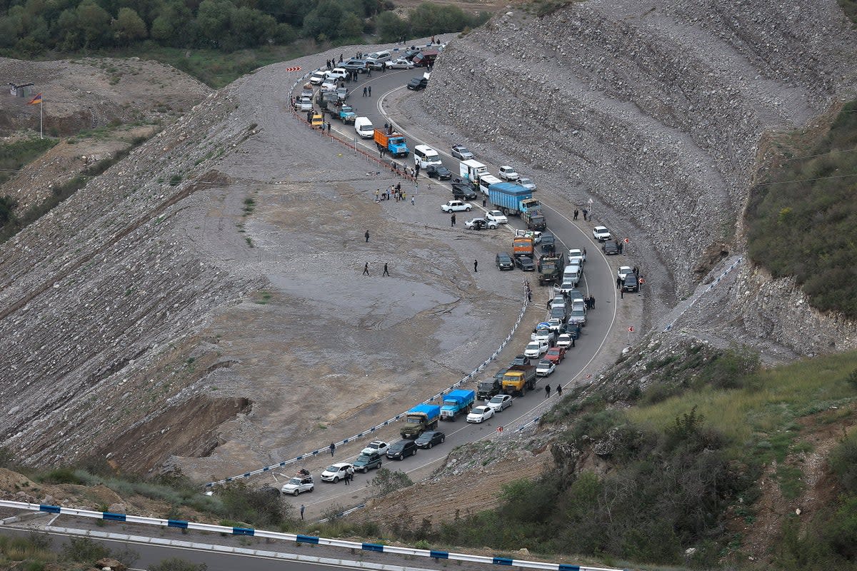 The convoy of cars carrying ethnic Armenians over mountain roads towards Armenia (AP)