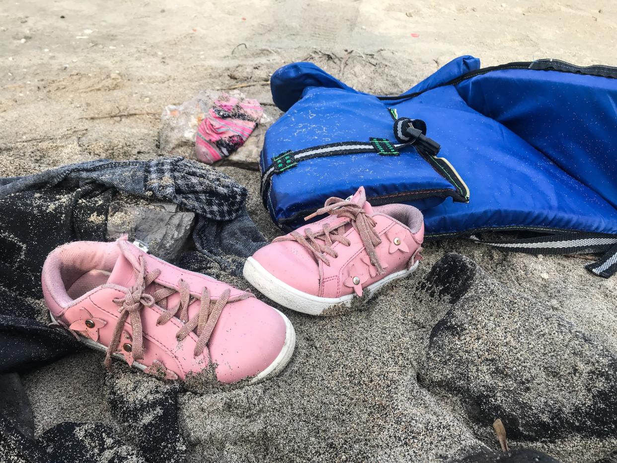 IZMIR, TURKEY - JANUARY 12: A pair of a child's shoes is seen after a boat carrying 19 irregular migrants capsized off the coast of Cesme in the Aegean province of Izmir, Turkey on January 12, 2020.  At least 11 irregular migrants, including eight children, were killed when their boat sank off the coast.          (Photo by Mahmut Serdar Alakus/Anadolu Agency via Getty Images)