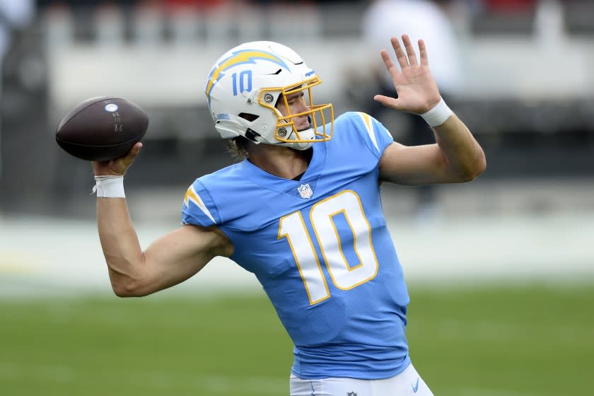 Los Angeles Chargers quarterback Justin Herbert (10) throws a pass before an NFL football game.