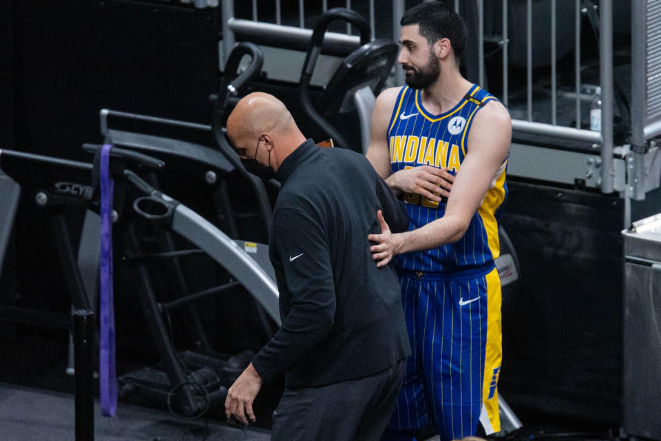 Indiana Pacers center Goga Bitadze tries to talk to assistant coach Greg Foster