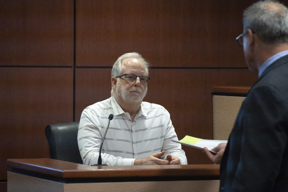 Chris Handsel testifies during the Kari Lake election challenge trial, Wednesday, May 17, 2023, in Maricopa County Superior Court, Mesa, Ariz. Maricopa County has a failed process for verifying thousands of ballot signatures that even some of its own workers question, attorneys for Lake, the 2022 Republican candidate for Arizona governor, argued in court Wednesday. (Mark Henle/The Arizona Republic via AP, Pool)