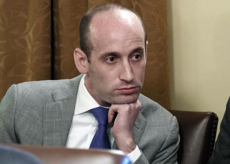 A close shot of Stephen Miller sitting, his chin resting on his left hand