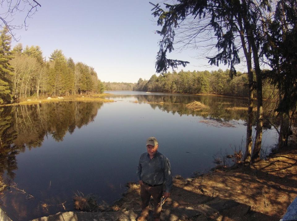 Kevin Breene, West Greenwich's town administrator, stands near Capwell Mill Pond in the Big River Management Area, where a reservoir was once planned to supplement the state's main water supply.