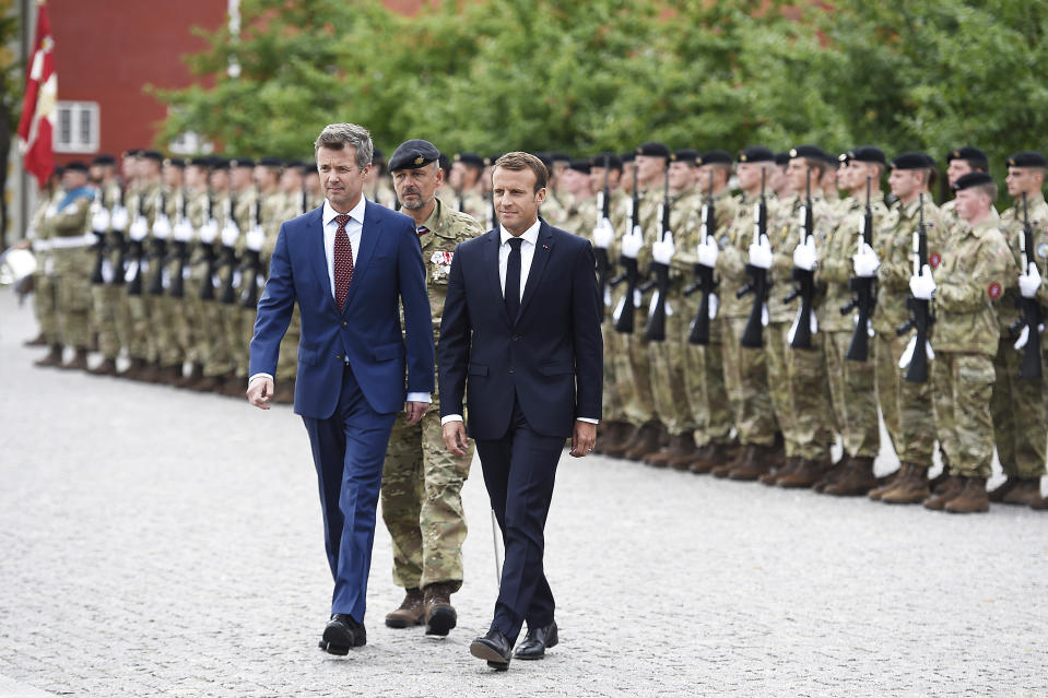 French President Emmanuel Macron and Denmark's Crown Prince Frederik attend a wreath laying ceremony at the Citadel of Copenhagen, in honor of fallen Danish soldiers on international missions, Tuesday Aug. 28, 2018. French President Emmanuel Macron is on a two-day visit, hoping to build the relationships he needs to push France's agenda of a more closely united European Union. (Liselotte Sabroe/Ritzau Scanpix via AP)