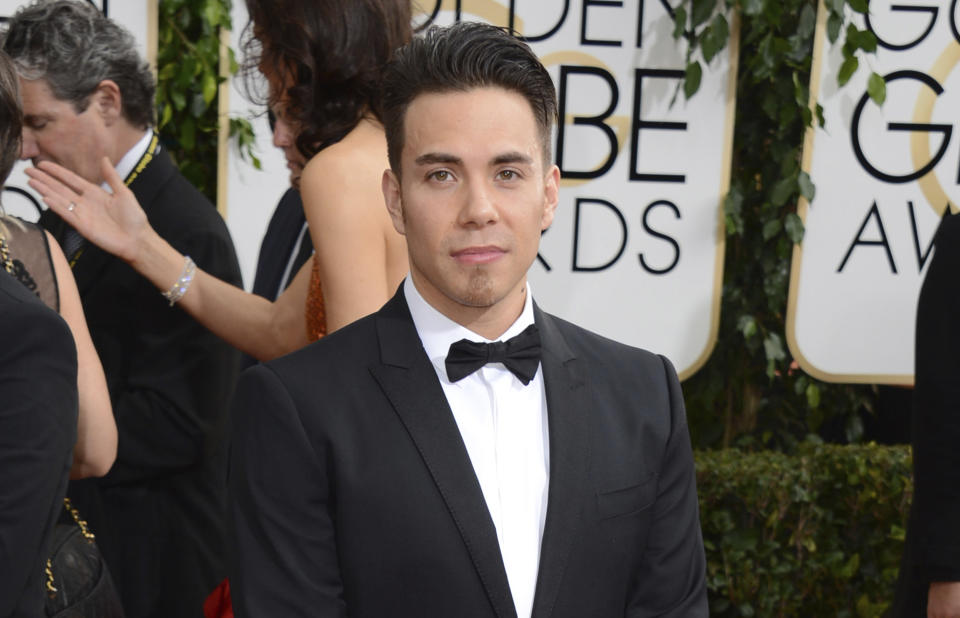 FILE - Apolo Ohno arrives at the 71st annual Golden Globe Awards on Jan. 12, 2014, in Beverly Hills, Calif. Olympians including Michael Phelps, Ohno and Jeremy Bloom are opening up about their mental health struggles in a new sobering documentary about suicide and depression among the world's greatest athletes. Many of the athletes are sharing their pain for the first time in HBO's "The Weight of Gold," which aims to expose the problem, incite change among Olympics leadership and help others experiencing similar issues feel less alone. (Photo by Jordan Strauss/Invision/AP, File)