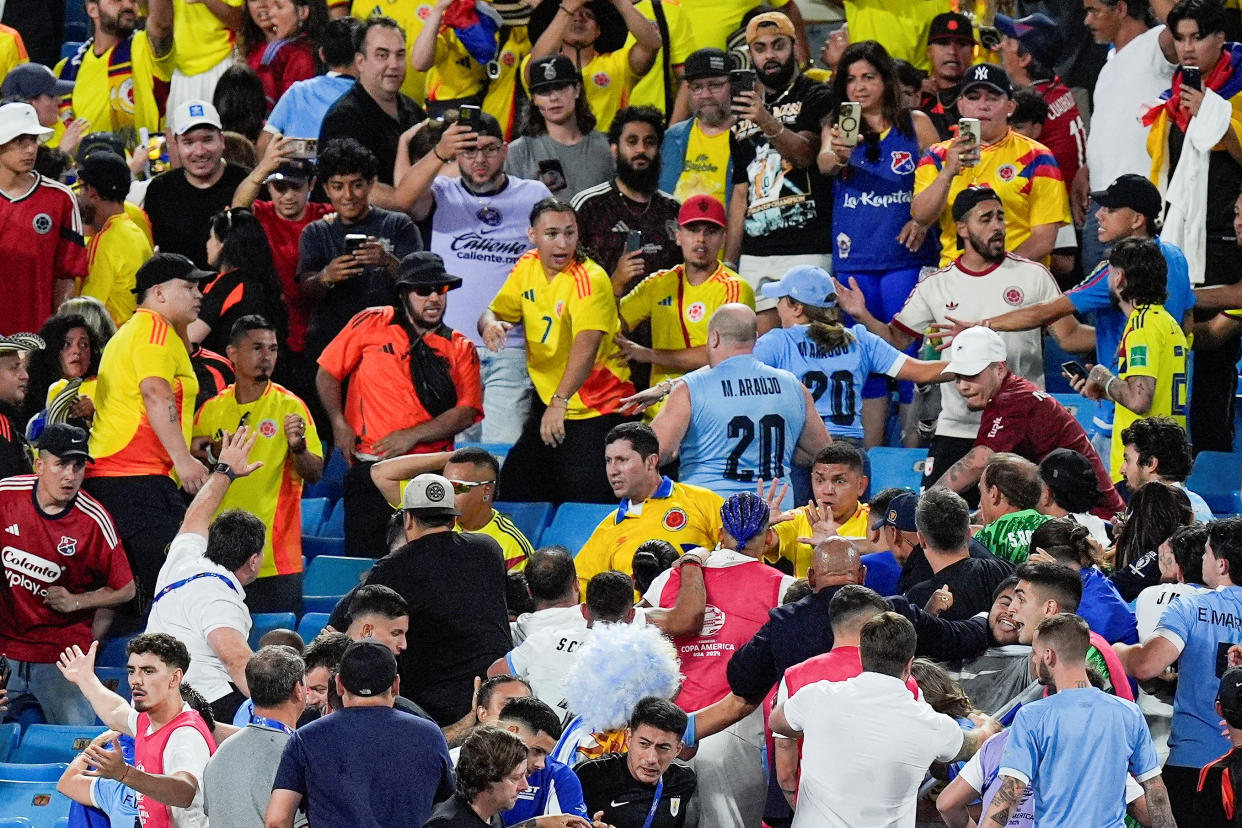 Fans get into an altercation with players and staff from Uruguay after the Copa Armerica semifinal match between Uruguay and Colombia on Wednesday. (Jim Dedmon-USA TODAY Sports)