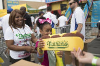 <p>Hot dog hats are distributed to the fans as the enter the Nathan’s Famous Fourth of July hot dog eating contest, Wednesday, July 4, 2018, in New York’s Coney Island. (Photo: Mary Altaffer/AP) </p>