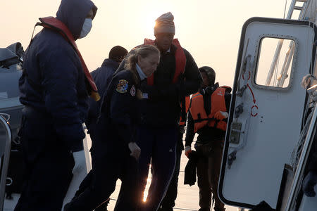 Congolese basketball player Christ Wamba is seen onboard a Hellenic Coast Guard vessel following a rescue operation, as Wamba and other migrants tried to cross part of the Aegean Sea from Turkey to Lesbos, on the island of Lesbos, Greece, March 21, 2016. REUTERS/Alkis Konstantinidis