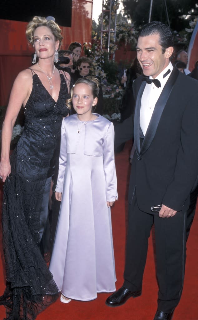 <p>While Johnson wowed in a gold Gucci dress at the 2017 Academy Awards, it wasn't the first time she attended the major event. In 2000, a then 10-year-old Johnson accompanied her stepfather and mom <a href="https://www.eonline.com/videos/232028/see-10-year-old-dakota-johnson-attend-first-oscars" rel="nofollow noopener" target="_blank" data-ylk="slk:to the Oscars;elm:context_link;itc:0;sec:content-canvas" class="link ">to the Oscars</a>. Wearing a purple dress and jacket, Johnson even did interviews with the couple, chatting with the late <strong>Joan Rivers</strong>, adorably turning to Griffith to ask, "Um...is it?" when Rivers asked if this was her first Oscars.</p>