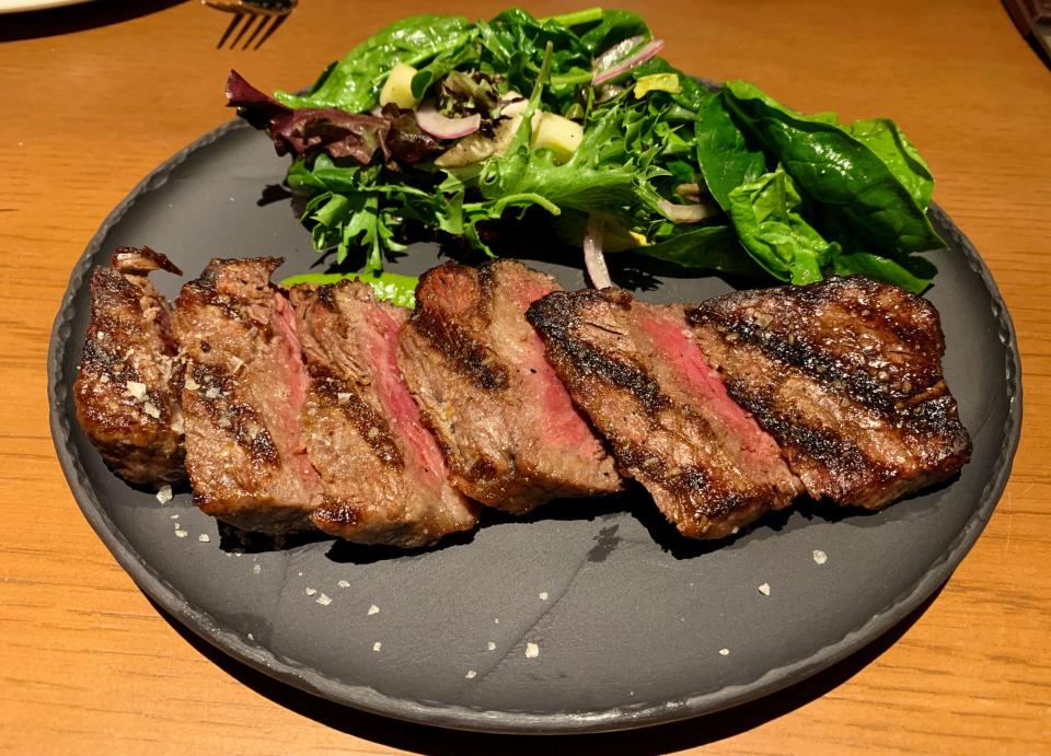 The wagyu New York Steak at Renata's Hearth comes with field greens and a red wine vinaigrette.