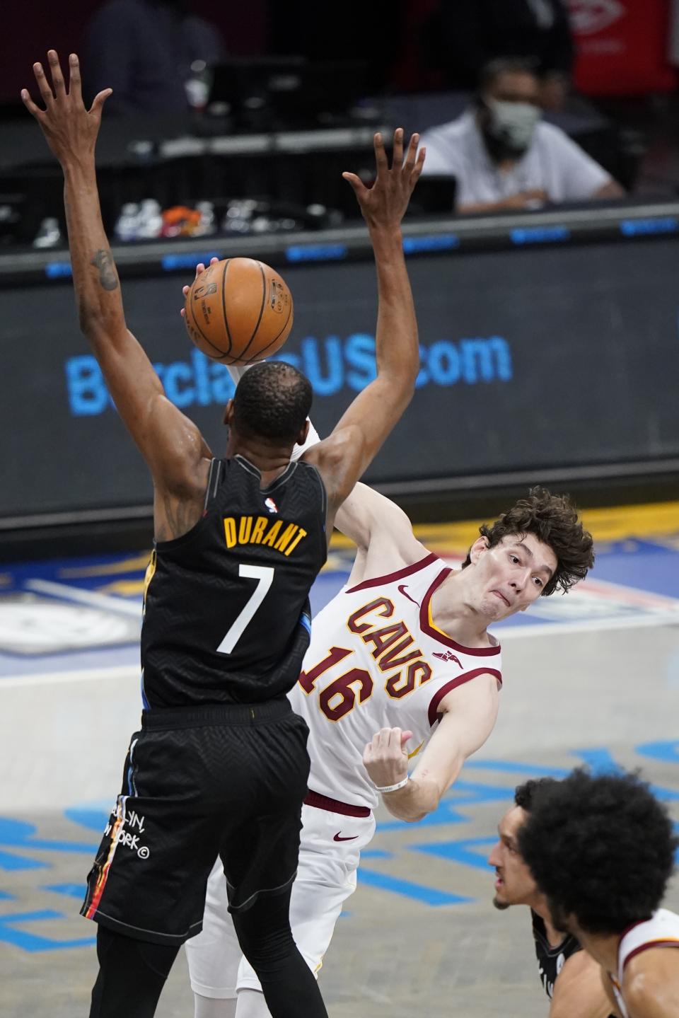 Cleveland Cavaliers' Cedi Osman (16) passes away from Brooklyn Nets' Kevin Durant (7) during the second half of an NBA basketball game Sunday, May 16, 2021, in New York. (AP Photo/Frank Franklin II)