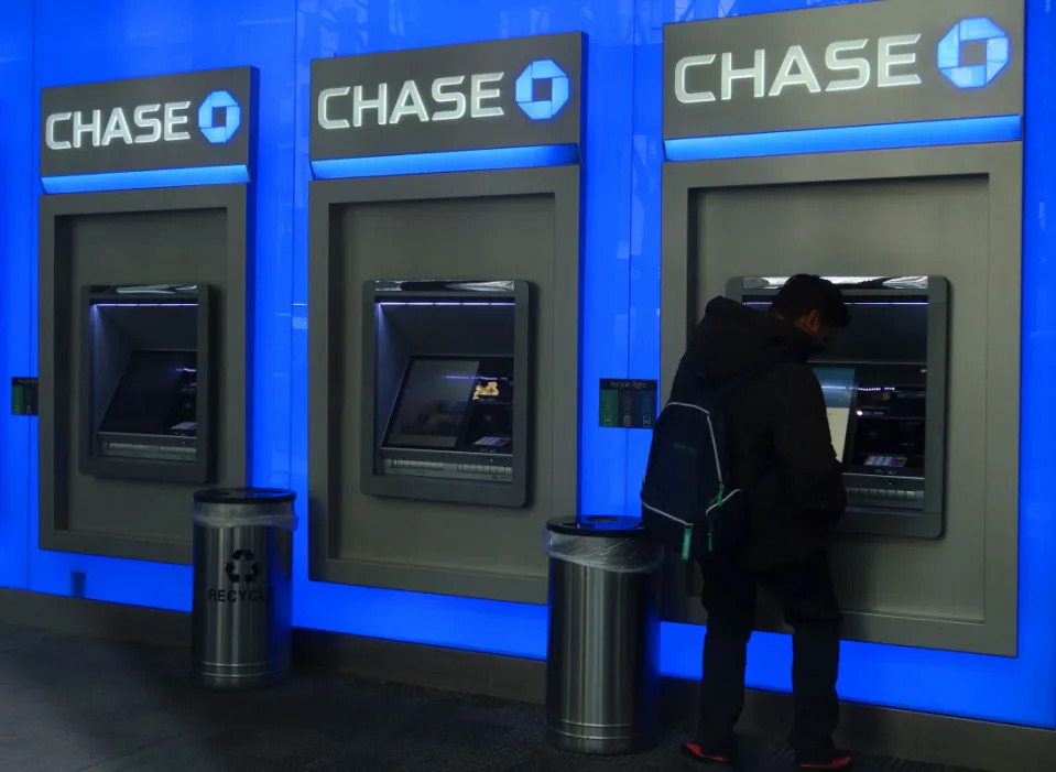 A person uses a Chase bank ATM on February 29, 2024, in New York City. <p>Gary Hershorn/Getty Images</p>