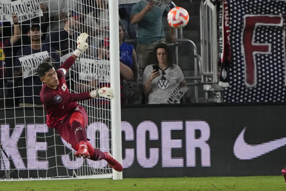 El Salvador goalkeeper Mario Gonzalez (1) clears the ball from his goal during the first half of a CONCACAF Nations League soccer match against the United States, Monday, March 27, 2023, in Orlando, Fla. (AP Photo/John Raoux)