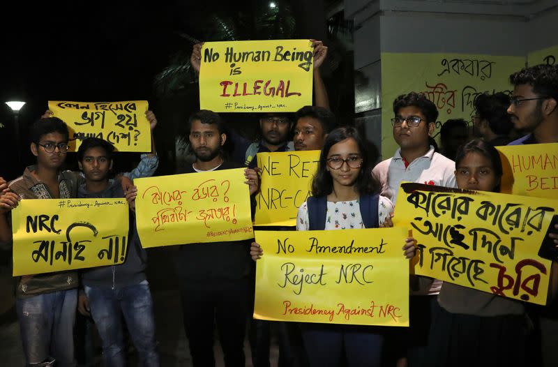 Students display placards as they attend a protest against National Register of Citizens and the Citizenship Amendment Bill, in Kolkata