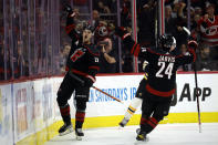 Carolina Hurricanes' Sebastian Aho (20) celebrates with teammate Seth Jarvis (24) after scoring during the first period of an NHL hockey game against the Boston Bruins in Raleigh, N.C., Sunday, Jan. 29, 2023. (AP Photo/Karl B DeBlaker)