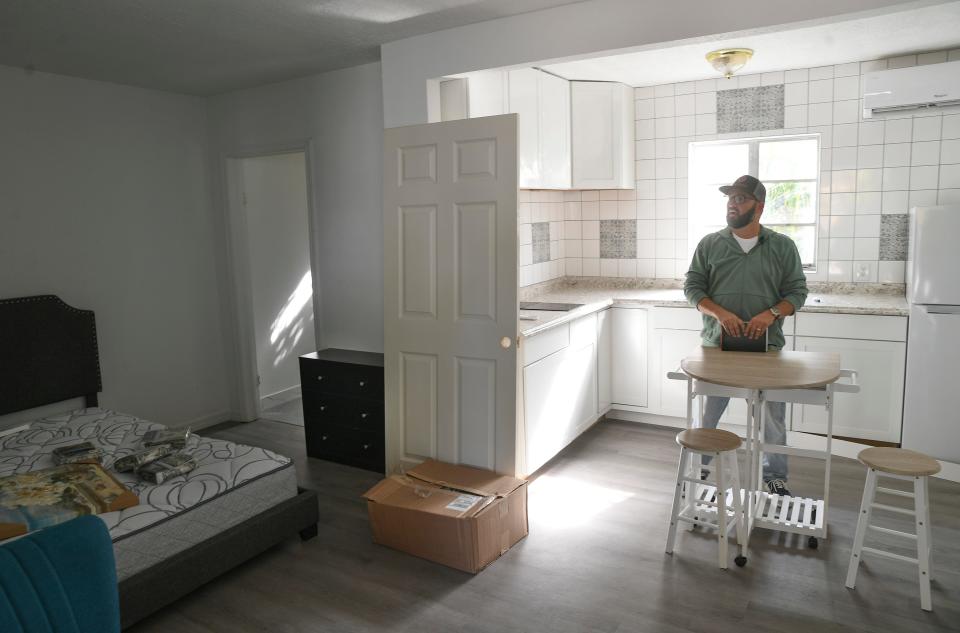 Tony Zorbaugh, executive director of The Source, is seen inside one of four efficiencies in Dignity Village that would rent for $450. a month, including cable and all utilities. The one bedroom units are $500. a month, and two bedroom for $650. a month, all including cable and all utilities.   