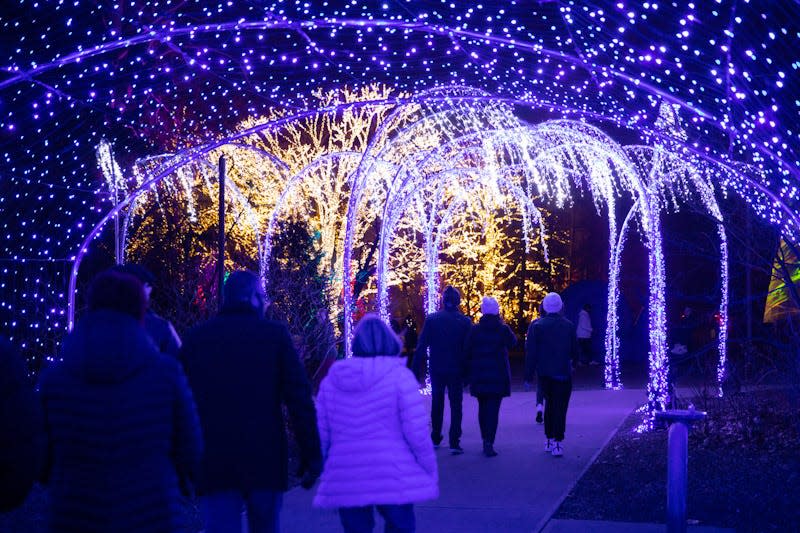 The beautifully decorated grounds at the Lilly House welcome visitors to Winterlights at Newfields in Indianapolis.