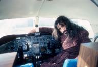 <p>Frank Zappa sits in the cockpit of an airplane in Detroit in 1976. </p>