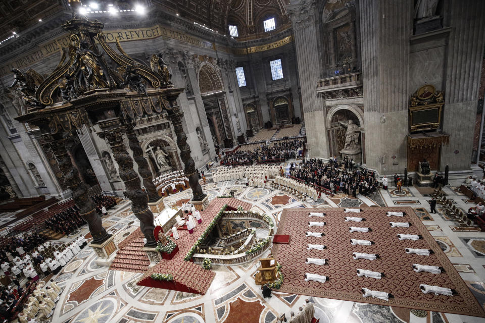 Priests lie face down on the floor during an ordination ceremony presided over by Pope Francis, in St. Peter's Basilica at the Vatican, Sunday, May 12, 2019. (Giuseppe Lami/Pool Photo Via AP)