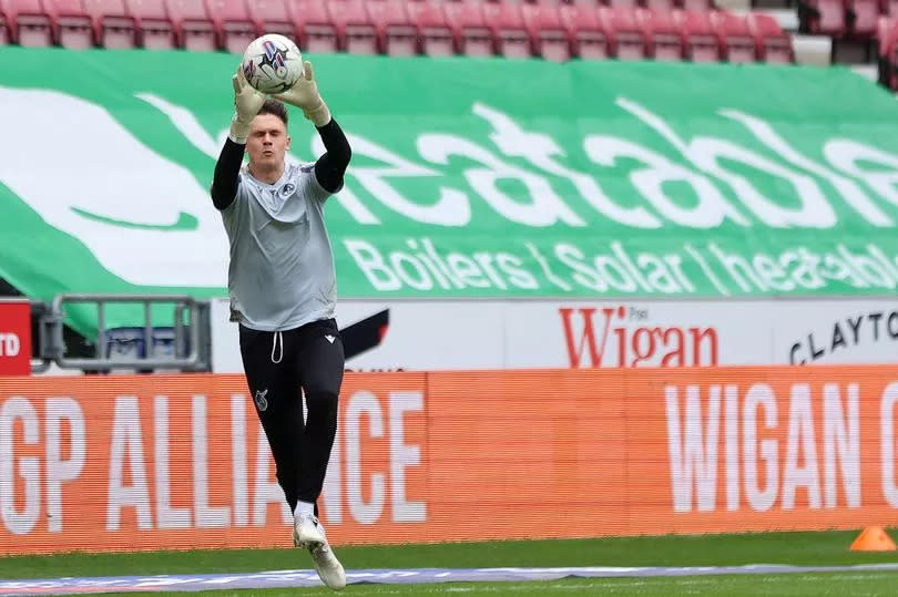 Jed Ward warms up for ahead of Bristol Rovers' game at Wigan Athletic -Credit:Paul Greenwood/EFL