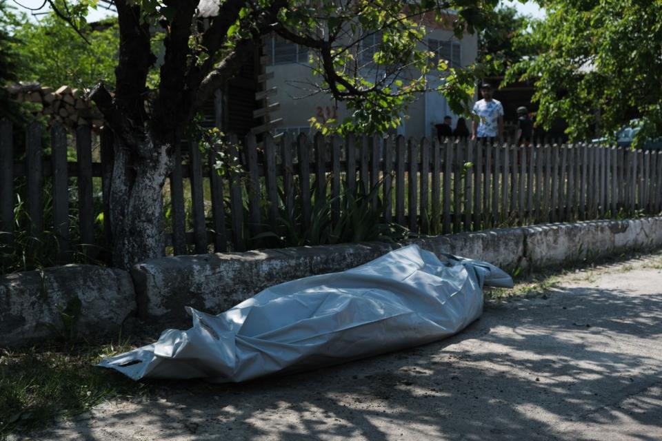 A body of a civilian killed in the Russian missile attack on a publishing factory in Kharkiv, Ukraine on May 23, 2024. (Francis Farrell/The Kyiv Independent)