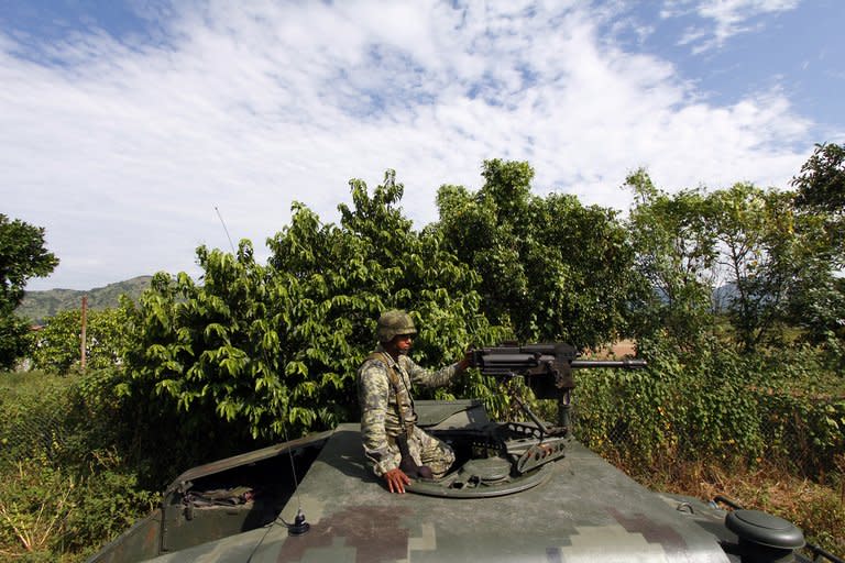 A soldier patrols the border area between the states of Jalisco and Nayarit, in Magdalena, on September 27, 2012. Police have detained the alleged leader of the Juarez drug cartel, a 47-year-old man known as "Ugly Betty," according to authorities