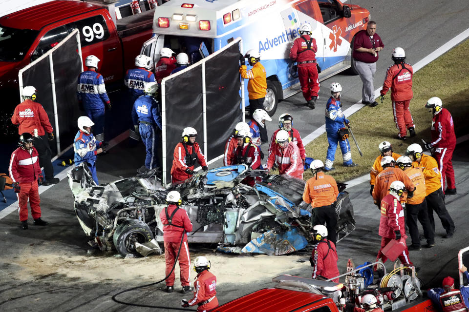 Ryan Newman is moved to an ambulance after rescue workers removed him from his car after he was involved in a crash on NASCAR Daytona 500 auto race at Daytona International Speedway, Monday, Feb. 17, 2020, in Daytona Beach, Fla. Sunday's race was postponed because of rain. (AP Photo/David Graham)