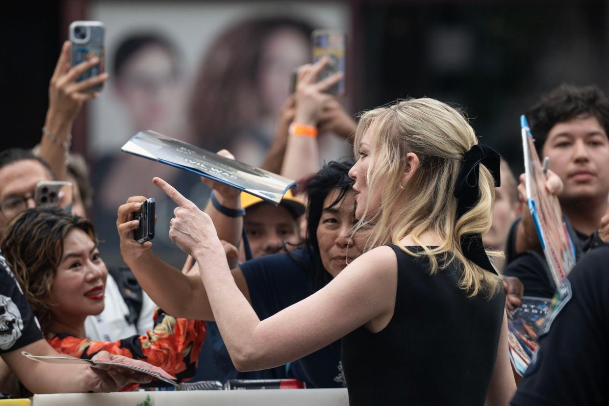 Actress Kirsten Dunst meets fans outside the premiere of 'Civil War' at the Paramount Theatre in downtown Austin during SXSW Thursday, March 14, 2024.