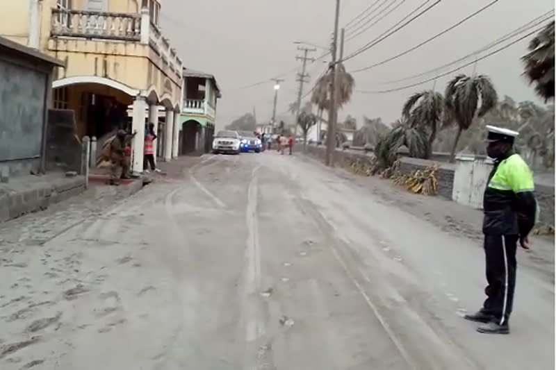 Ash covers roads a day after the La Soufriere volcano erupted after decades of inactivity in St Vincent and the Grenadines