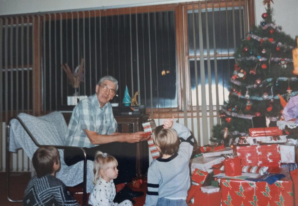 Albert Seaburg passes out Christmas gifts.