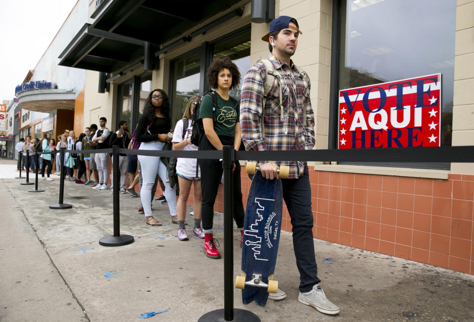 In this Tuesday, Nov. 8, 2016 file photo, voters wait in line to cast their ballots at the polling location in the University Co-op next to the University of Texas at Austin campus in Austin. On Friday, Feb. 1, 2018, The Associated Press has found that stories circulating on the internet that 58,000 non-citizens voted in Texas, are untrue. (Jay Janner/Austin American-Statesman via AP)