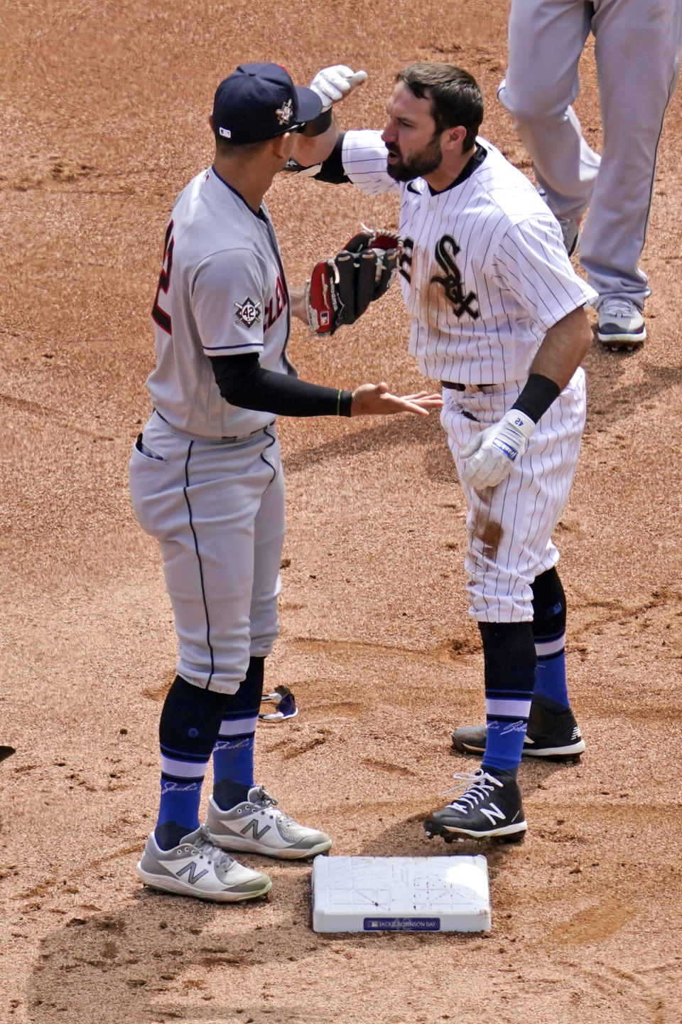 Chicago White Sox's Adam Eaton, right, reacts to Cleveland Indians shortstop Andres Gimenez after Gimenez tagged him out at second base during the first inning of a baseball game in Chicago, Thursday, April 15, 2021. (AP Photo/Nam Y. Huh)