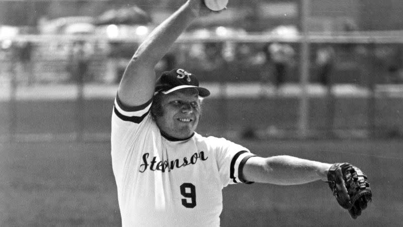 Larry H. Miller is pictured winding up to pitch during a fast pitch softball game in this undated photo.