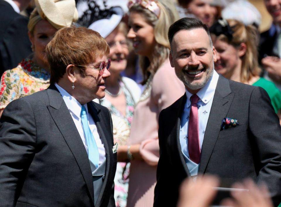 Sir Elton John attends the wedding of Prince Harry and Meghan Markle with his husband David Furnish (AFP/Getty Images)