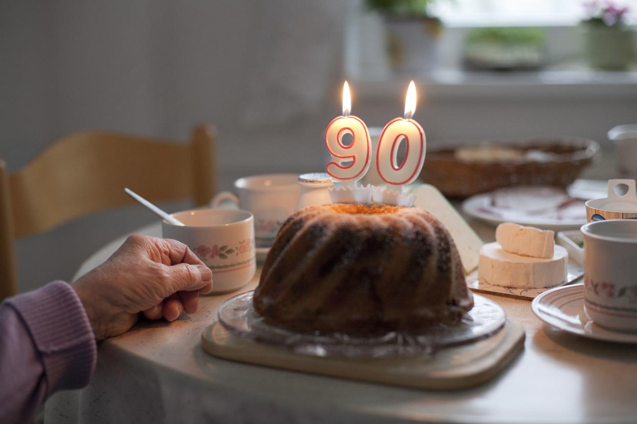 woman having breakfast on her 90th birthday