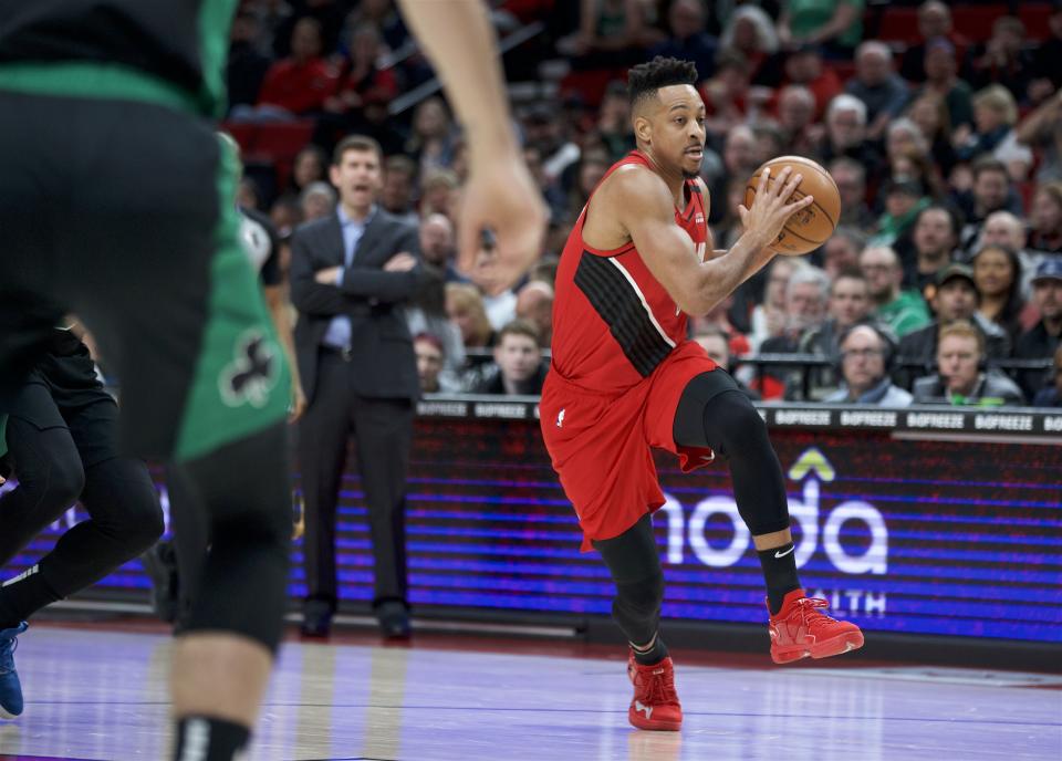 Portland Trail Blazers guard CJ McCollum drives to the basket against the Boston Celtics during the first half of an NBA basketball game in Portland, Ore., Tuesday, Feb. 25, 2020. (AP Photo/Craig Mitchelldyer)