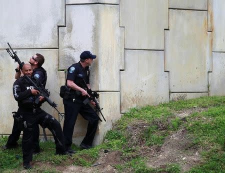 Law enforcement officers are seen as the search for suspects is conducted near the airport perimeter following a shooting incident at Fort Lauderdale-Hollywood International Airport in Fort Lauderdale, Florida, U.S. January 6, 2017. REUTERS/Andrew Innerarity