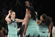 New York Liberty forward Breanna Stewart (30) and forward Jonquel Jones (35) celebrate after Stewart scored a three-point basket during the second half of Game 2 of a WNBA basketball playoffs semifinal against the Connecticut Sun, Tuesday, Sept. 26, 2023, in New York. The Liberty won 84-77. (AP Photo/Mary Altaffer)