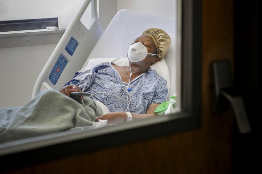 VICTORVILLE, CA - APRIL 25: Janice Brown suffering from novel coronavirus, under treatment in a COVID-19 unit at Desert Valley Medical Group, Victorville. The first time Janice Brown landed in the hospital on March 24, she complained of cough and congestion for one week and of an intermittent fever. She was the first patient in the hospital who tested positive for COVID 19 and who was placed in the hospital's isolation unit. After going 72 hours without symptoms, she was released on April 3 and believed the worst had passed. On April 21, she landed back in the hospital and once again tested positive for coronavirus. (Irfan Khan / Los Angeles Times)