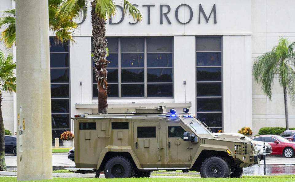 An armored police vehicle enters the Town Center at Boca Raton parking lot in front of Nordstrom, Sunday, Oct. 13, 2019, in Boca Raton, Fla., as the mall had been placed on lockdown following reports of shots fired. (Andres Leiva/Palm Beach Post via AP)