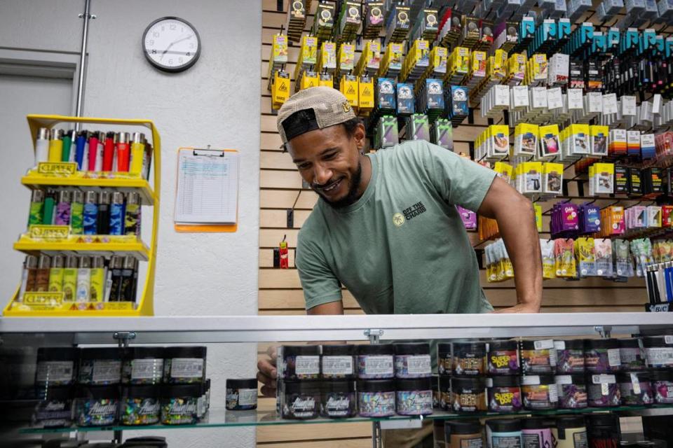 Off The Charts owner Mike Snell gets a product behind the counter for a customer earlier this month at his recently opened marijuana dispensary. It is Sacramento’s second social equity dispensary.